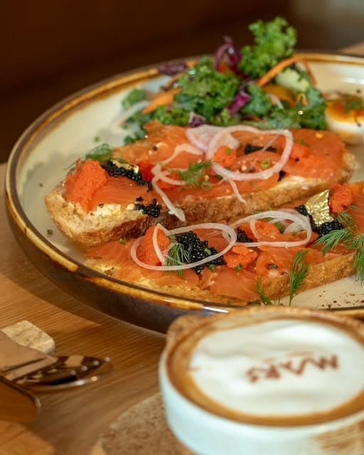 MARS Iconic Breakfast with cured salmon toast, caviar, eggs and salad